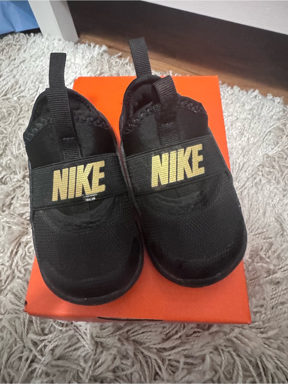 Nike Kids Black Slip-On Sneakers with Gold Logo